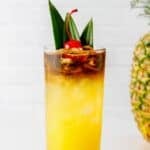 Homemade PF Chang's mai tai cocktail on a coaster.