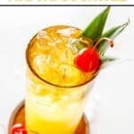 Homemade PF Chang's mai tai cocktail with a cherry.