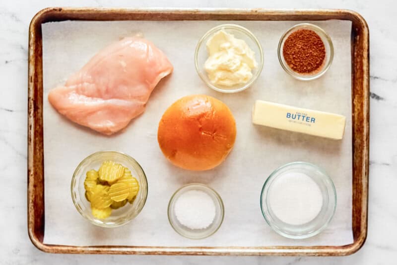Copycat Popeyes blackened chicken sandwich ingredients on a tray.