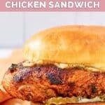Homemade Popeyes blackened chicken sandwich with pickles.