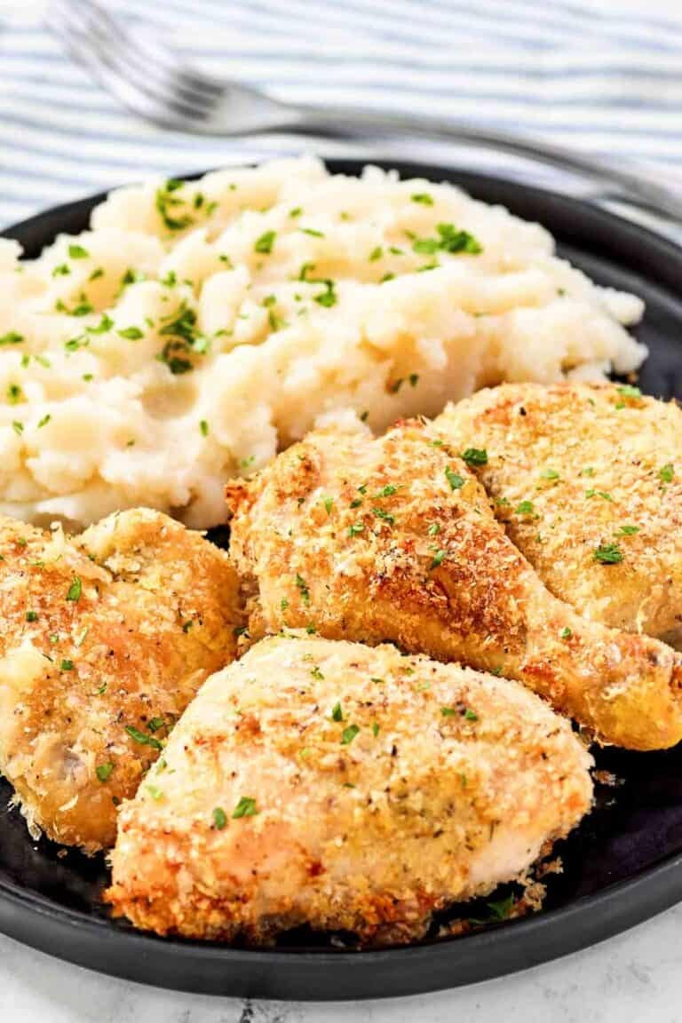 Crispy potato flake chicken and mashed potatoes on a plate.