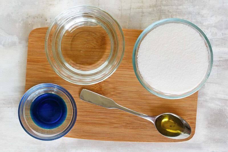 Ingredients for Sonic ocean water drink on a small wood board.
