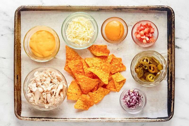 Copycat Subway Doritos footlong chicken nachos ingredients on a tray.