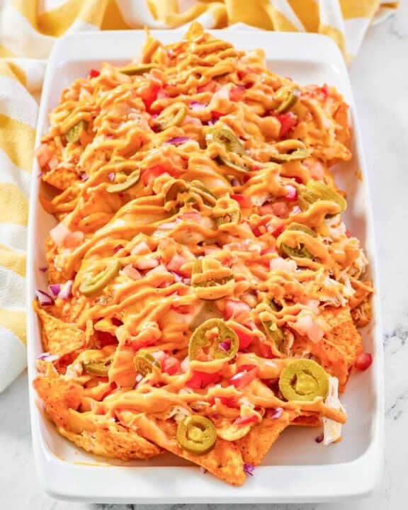 Copycat Subway Doritos footlong chicken nachos on a platter.