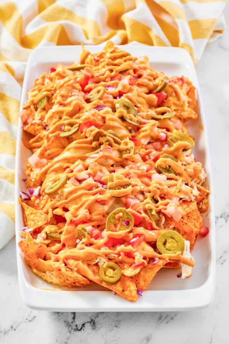 Copycat Subway Doritos footlong chicken nachos on a platter.
