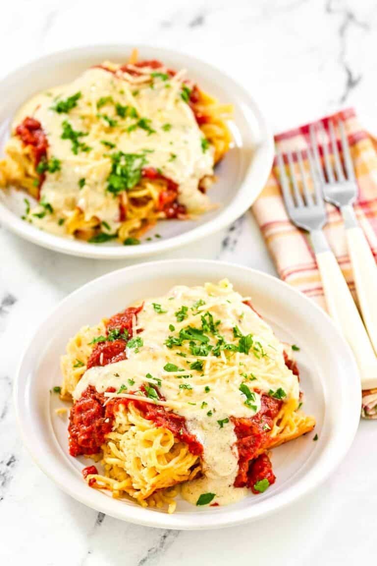 Copycat Cheddar's spasagna in two shallow bowls.