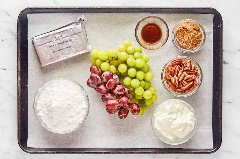 Copycat chicken salad chick grape salad ingredients on a tray.