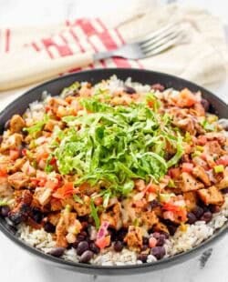 Copycat chipotle honey chicken, beans, and pico de gallo over rice.