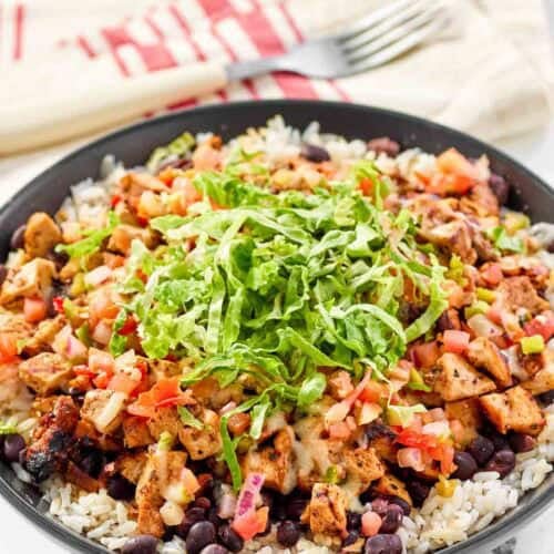 Copycat chipotle honey chicken, beans, and pico de gallo over rice.