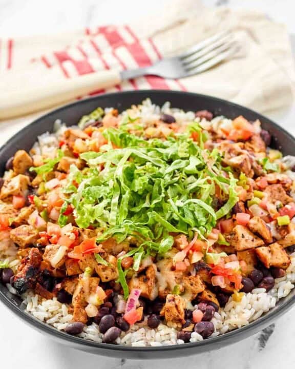 Copycat chipotle honey chicken, beans, and pico de gallo over rice.