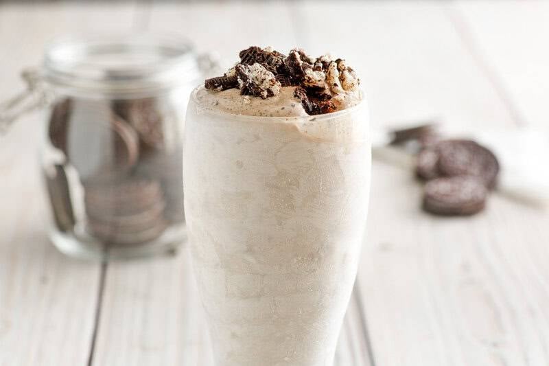 Copycat Dairy Queen oreo blizzard and oreos behind it.