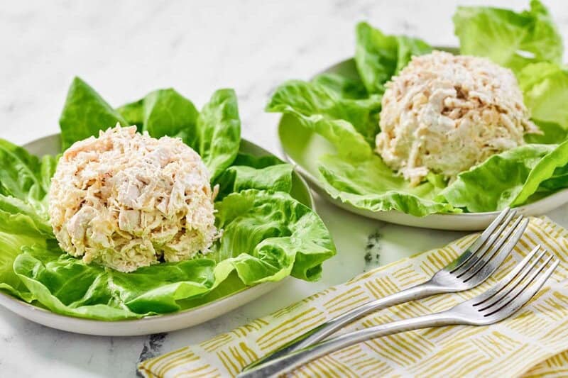 Two servings of copycat Jason's Deli chicken salad on lettuce.