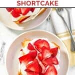 Homemade Jason's Deli strawberry shortcake on two plates and two forks on a napkin.