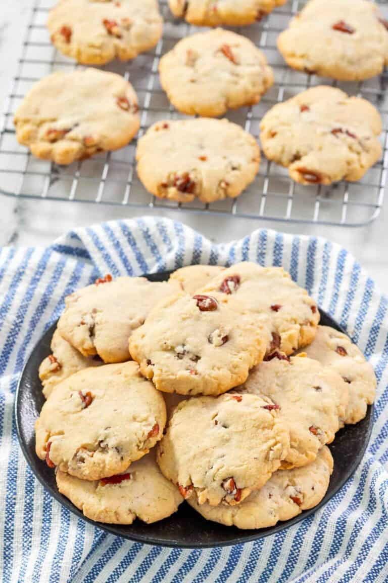 Copycat Keebler pecan sandies cookies on a plate and wire rack.