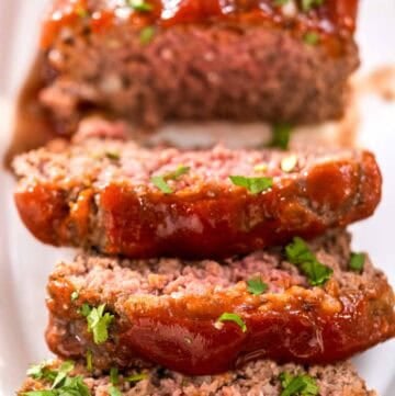 Mamma Joe's meatloaf on a platter and three slices cut from it.