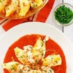 Homemade Olive Garden giant cheese stuffed shells in a bowl and baking dish.