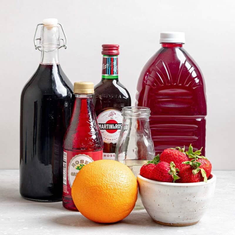 Copycat Olive Garden sangria ingredients on a marble surface.
