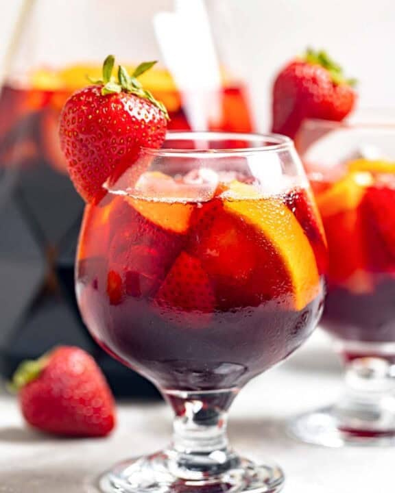 Copycat Olive Garden sangria in glasses and a pitcher.
