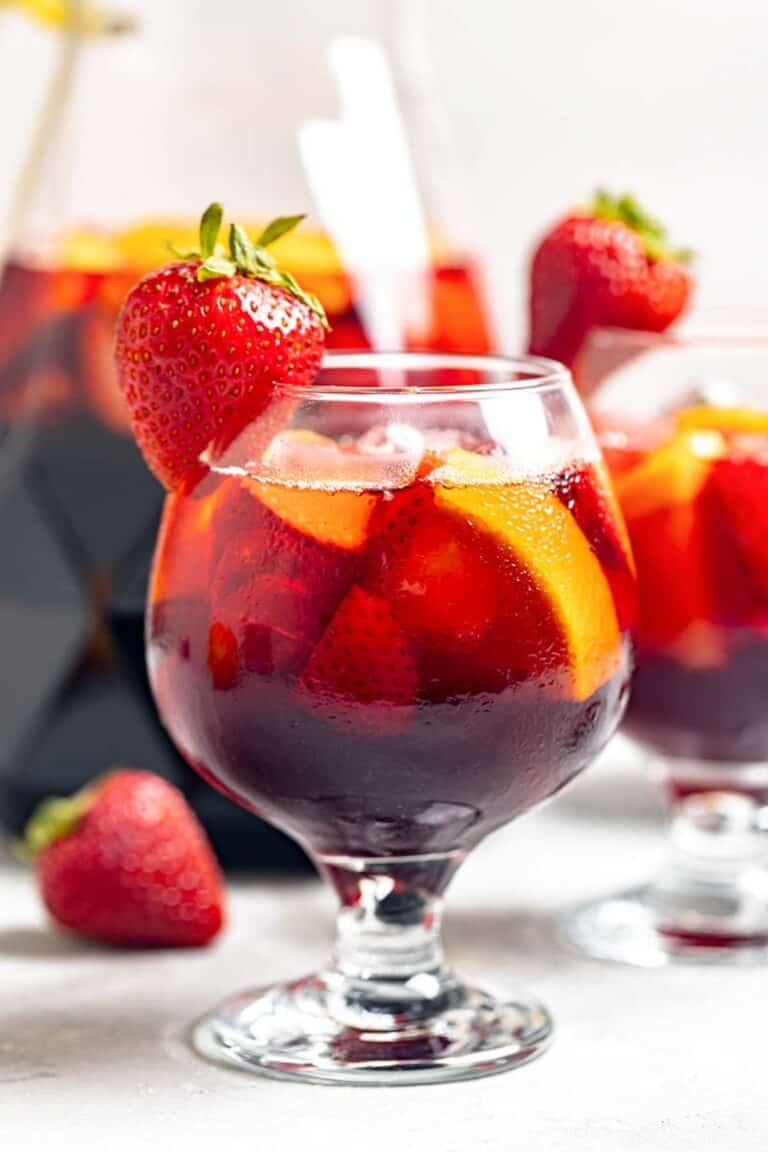Copycat Olive Garden sangria in glasses and a pitcher.