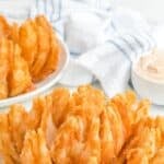 Copycat Outback Steakhouse bloomin onion on two plates.