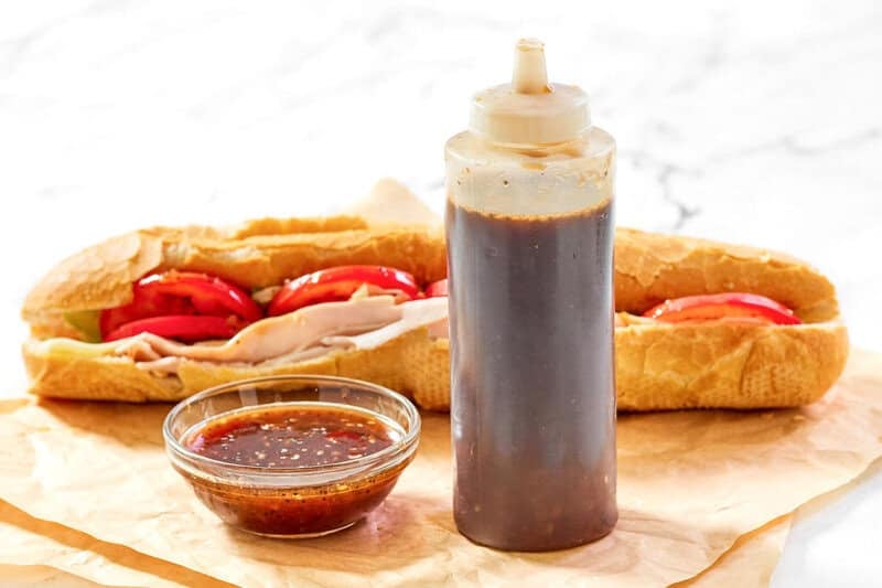 Copycat Subway sweet onion teriyaki sauce in a squeeze bottle and small glass bowl.