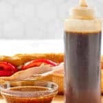 Copycat Subway sweet onion teriyaki sauce in a small bowl and squeeze bottle.