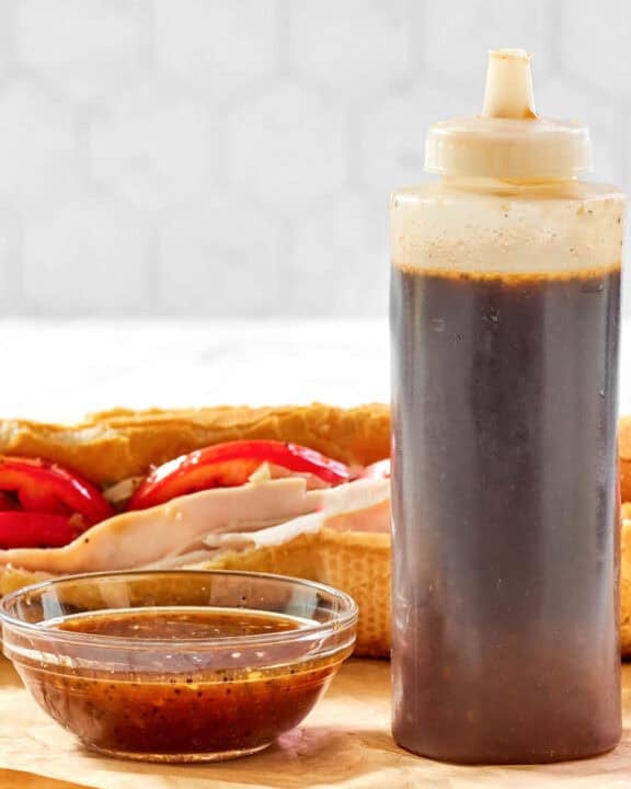 Copycat Subway sweet onion teriyaki sauce in a small bowl and squeeze bottle.