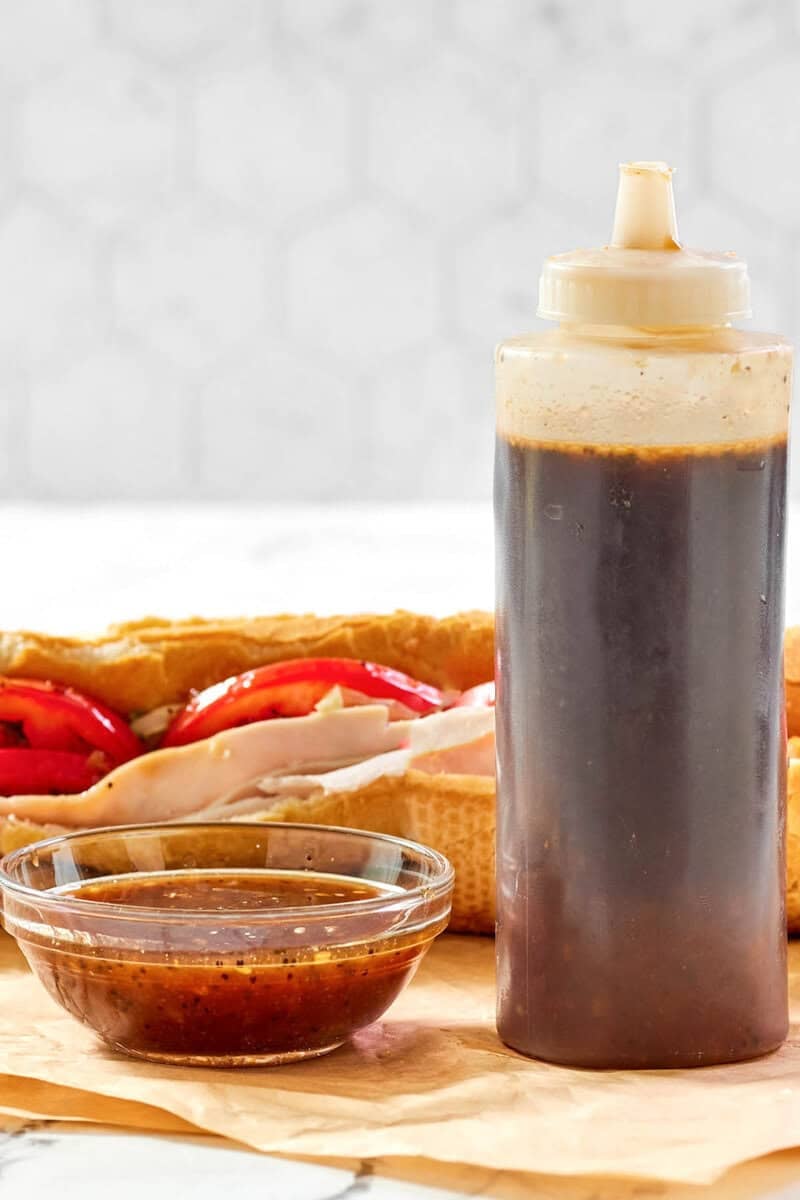 Copycat Subway sweet onion teriyaki sauce in a small bowl and squeeze bottle.