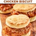 Homemade Wendy's honey butter chicken biscuits on a wood board.