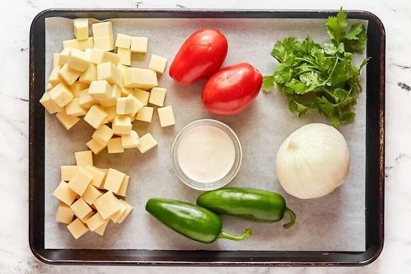 Copycat Applebee's queso blanco ingredients on a tray.