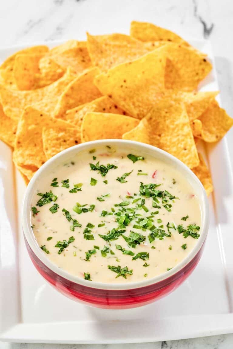 Copycat Applebee's queso blanco dip and tortilla chips on a platter.