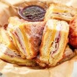 Copycat Cheddar's monte cristo sandwich served with raspberry jam.