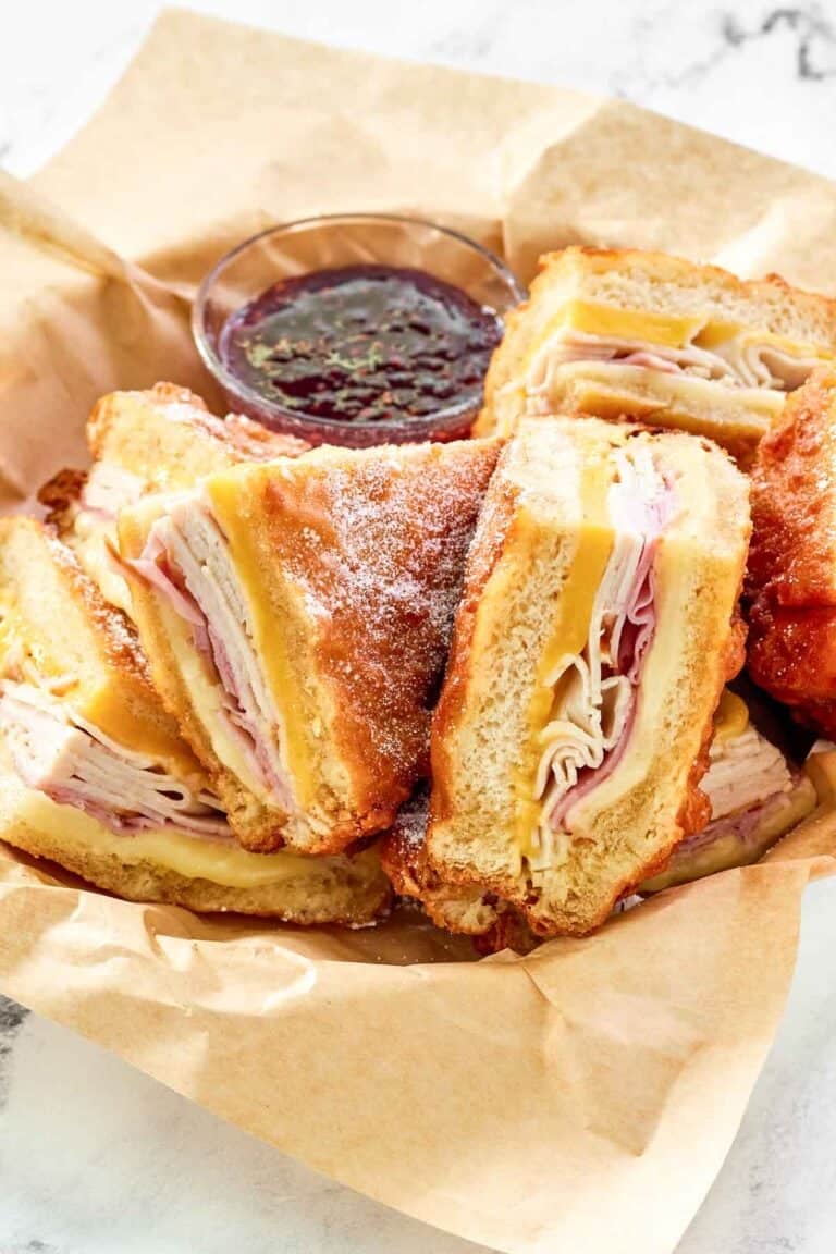 Copycat Cheddar's monte cristo sandwich served with raspberry jam.