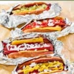 Homemade Five Guy hot dogs with different toppings.