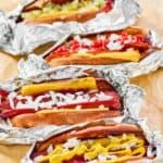 Homemade Five Guys hot dogs with various toppings.