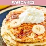 Homemade IHOP bananas foster pancakes with brown sugar syrup and whipped cream.