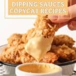 Dipping a chicken strip into honey mustard sauce.