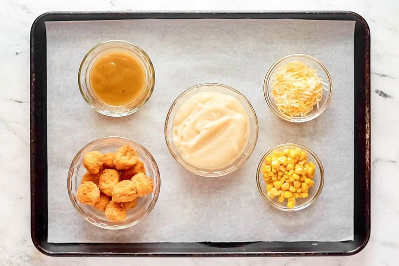 Copycat KFC famous bowl ingredients on a tray.