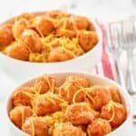 Two homemade KFC famous bowls and forks on napkins.