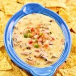 Copycat HEB tex-mex brisket queso dip with tortilla chips.