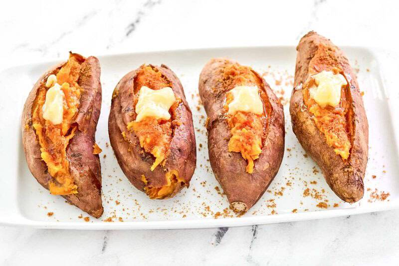 Copycat Outback Steakhouse baked sweet potatoes with brown sugar and honey butter.