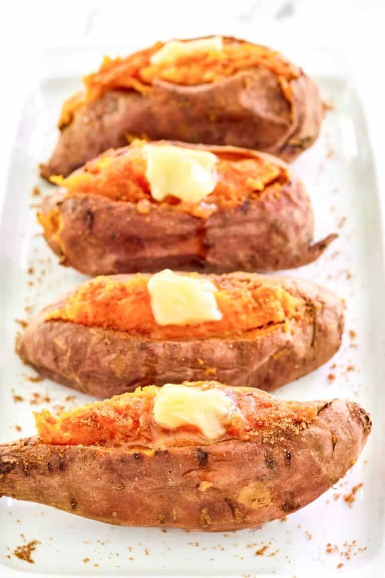 Copycat Outback Steakhouse baked sweet potatoes with honey butter and brown sugar.