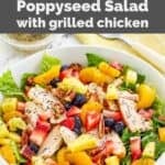 Homemade Panera strawberry poppyseed salad with chicken in a bowl.