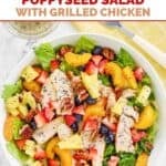 A bowl of Panera strawberry poppyseed salad with grilled chicken.