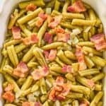 Copycat Texas Roadhouse green beans with bacon and onion in a serving dish.
