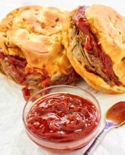 Copycat Arby's red ranch sauce and two roast beef sandwiches.