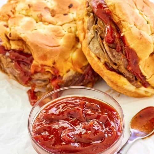 Copycat Arby's red ranch sauce and two roast beef sandwiches.