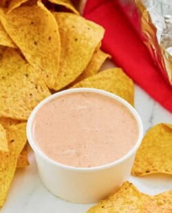 Copycat Chipotle adobo ranch in a small bowl and corn tortilla chips.