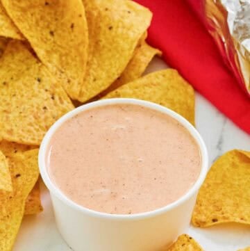 Copycat Chipotle adobo ranch in a small bowl and corn tortilla chips.
