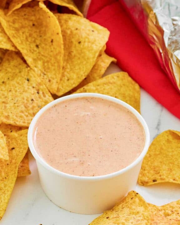 Copycat Chipotle adobo ranch in a small bowl and corn tortilla chips.